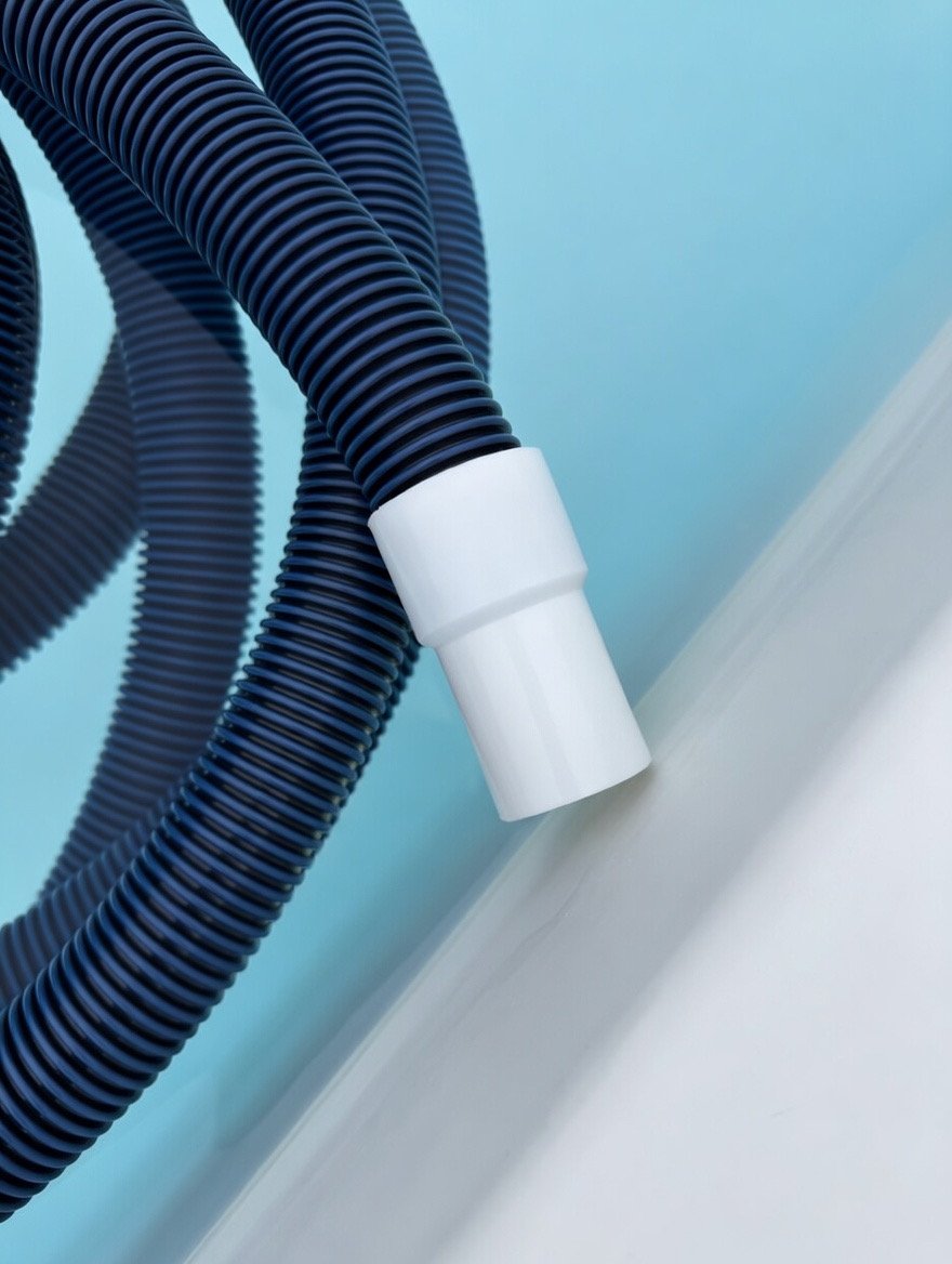 Pool vacuum hose ready for a cleaning visit